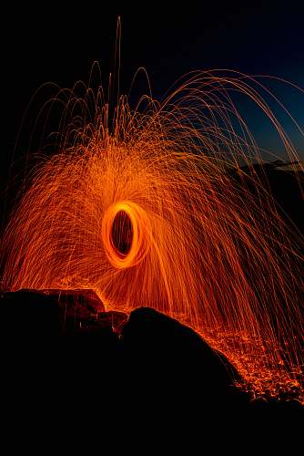 wading river beach person taking photo of round steel wool wading river